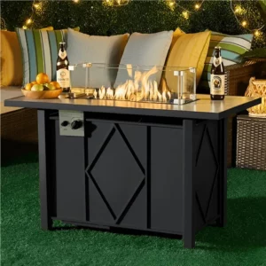 43” Propane Fire Pit Table with beige-gray ceramic tabletop and matte black powder-coated steel base, featuring blue fire stones and a protective cover.